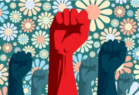 Raised fists of different shades against a floral background, symbolizing unity and strength amidst diversity.