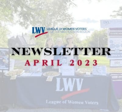 A booth for the League of Women Voters of the Mid-Hudson Region with brochures and items on display, titled "Newsletter April 2023" at the top.